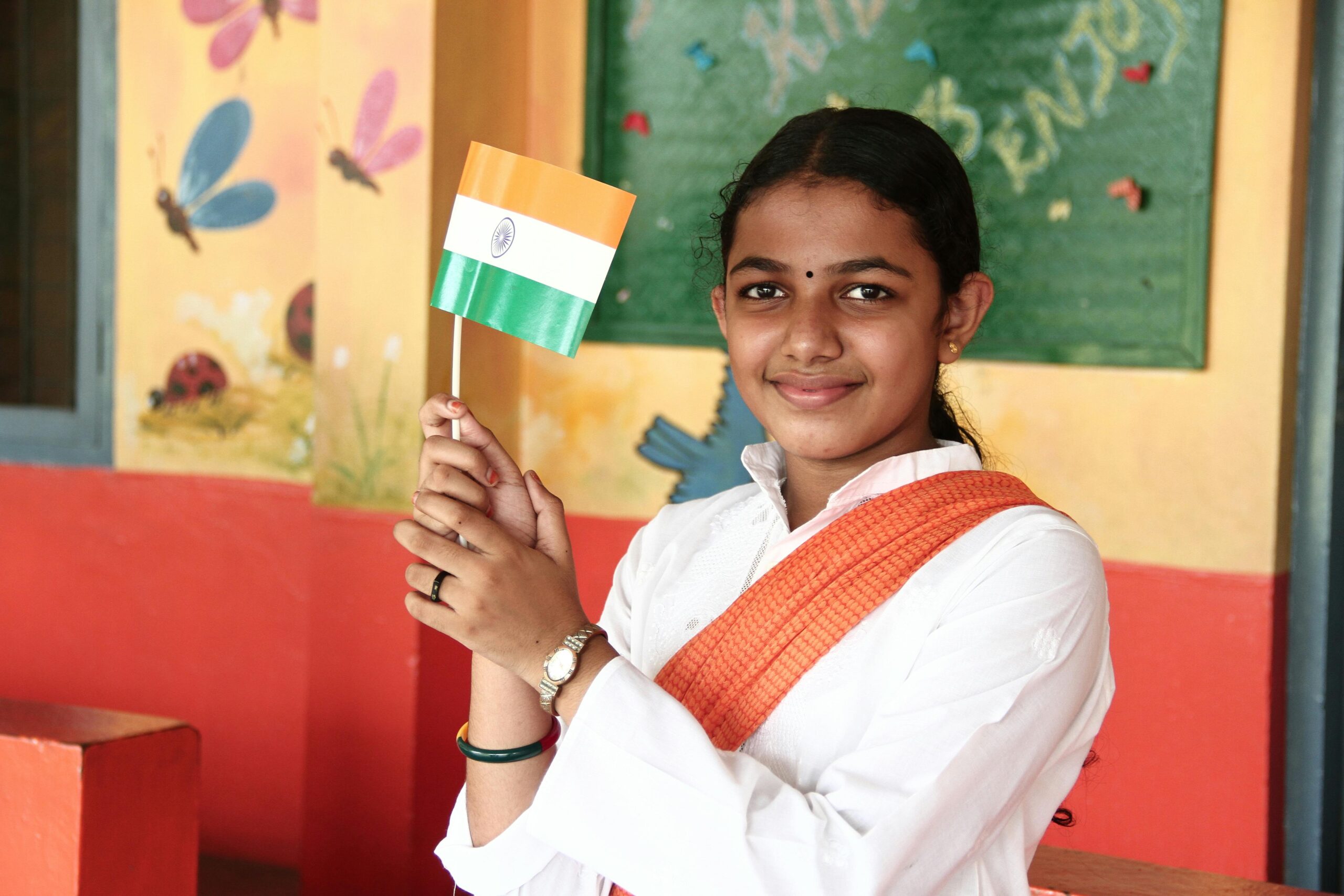 A Woman in White Long Sleeve Holding a Flag